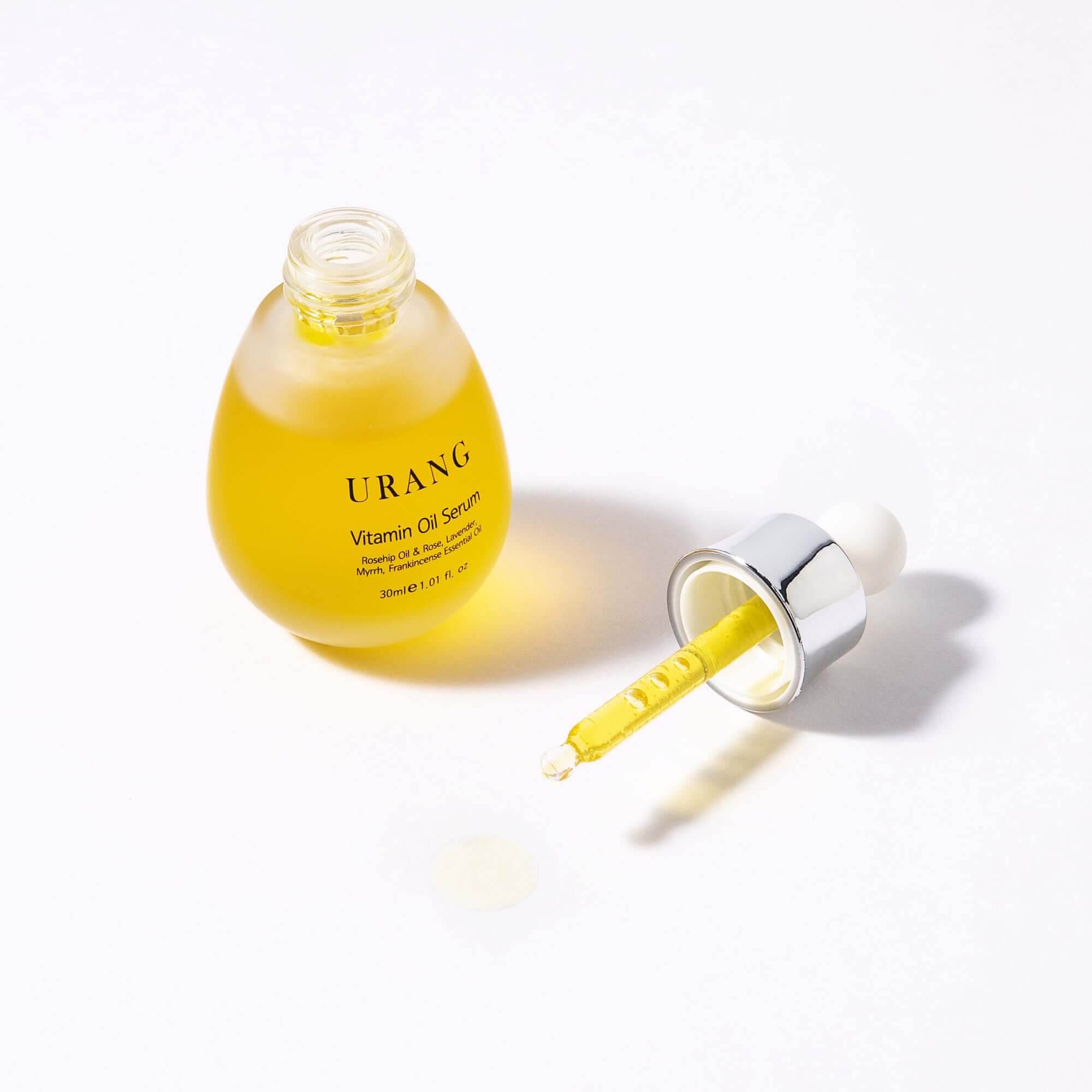 URANG Glow Oil Serum 30ml bottle with dropper on white background