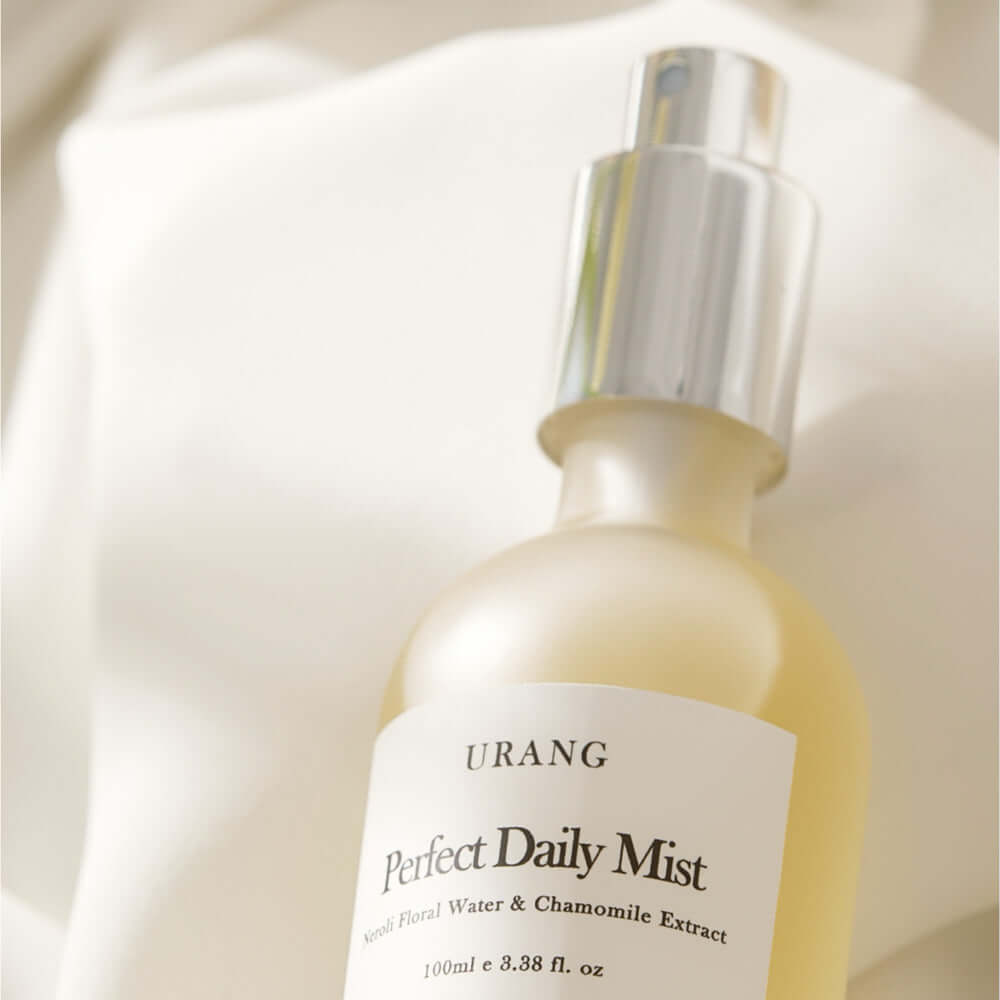 URANG Perfect Daily Mist 100ml bottle on a soft fabric background