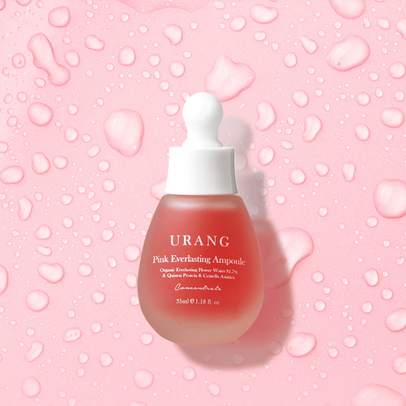 Photo of URANG Pink Everlasting Ampoule on a pink background with water droplets.