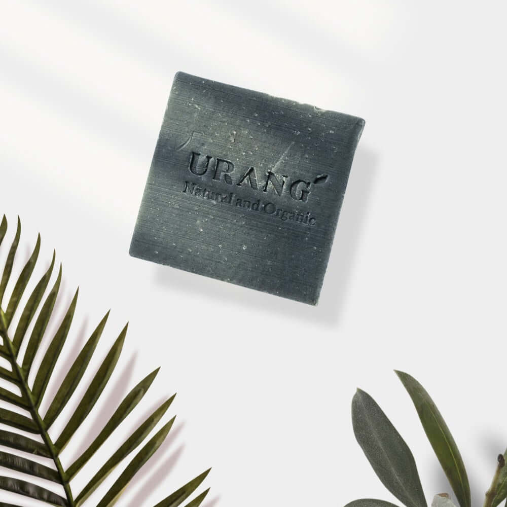 URANG Troubleshooter CP Handmade Soap with natural ingredients, square-shaped on white background with palm leaves.