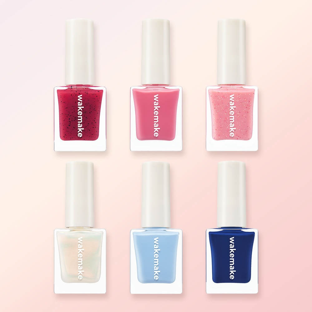 Variety of WAKEMAKE Nail Gun (#08 to #167) polish bottles in assorted colors for vibrant nail art.