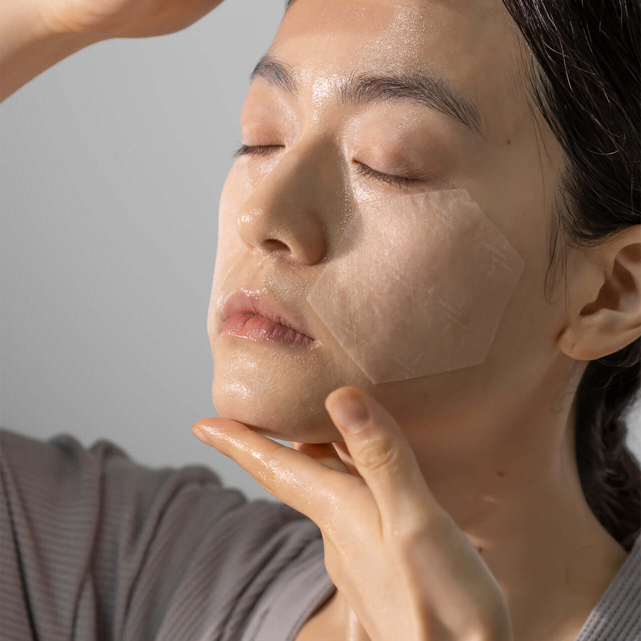 Woman applying XOUL Extreme Frozen Mask 10g to her face