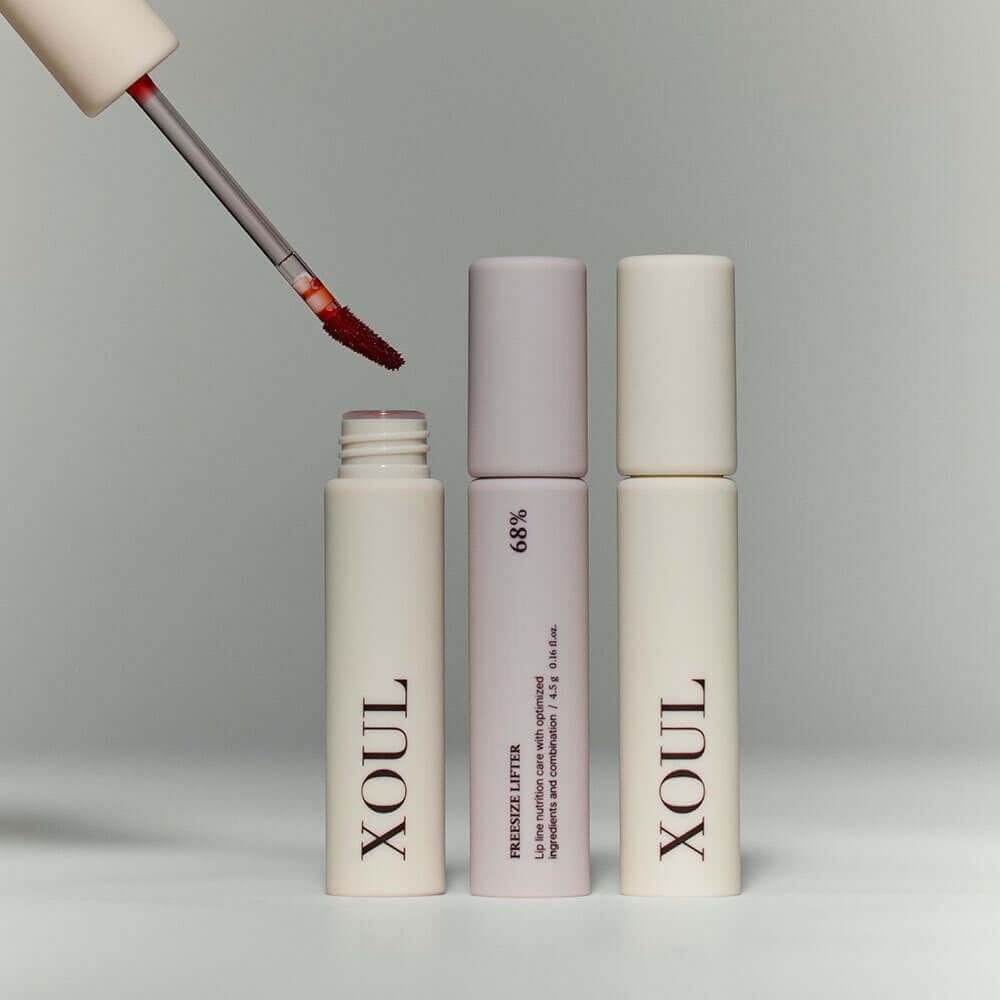 XOUL Lip Line Tattoo product displaying two lip products, one with an open applicator showing vibrant color.