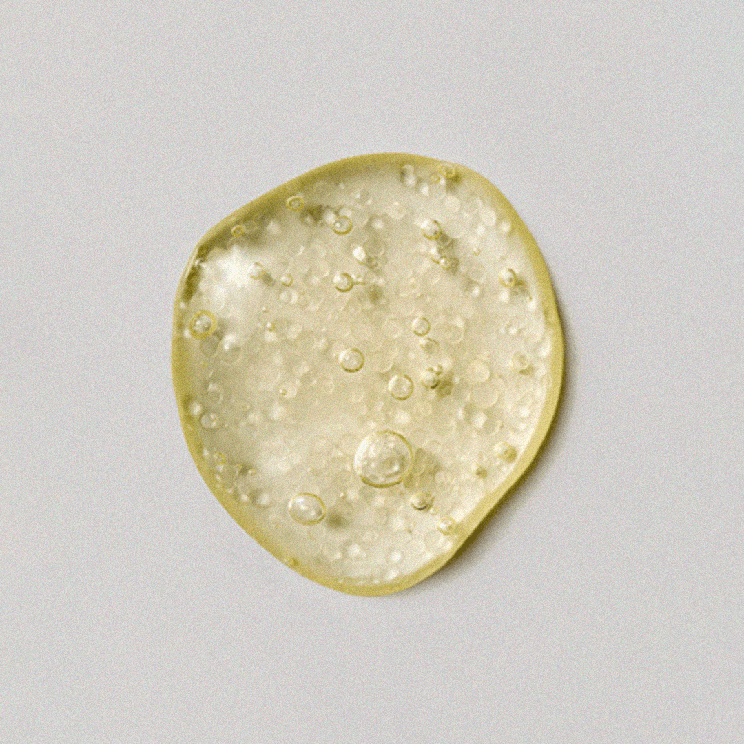 Texture of XOUL Micro Derma Booster 30ml serum showing gel-like consistency with bubbles