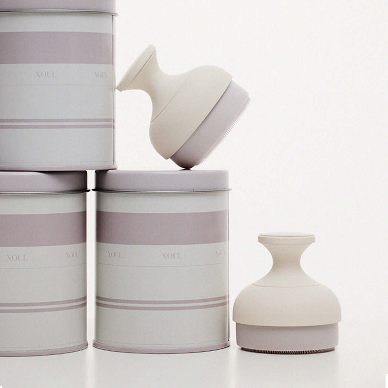 XOUL Silky Smoothing Cleansing Ball next to elegant packaging, showcasing luxury skincare product design.