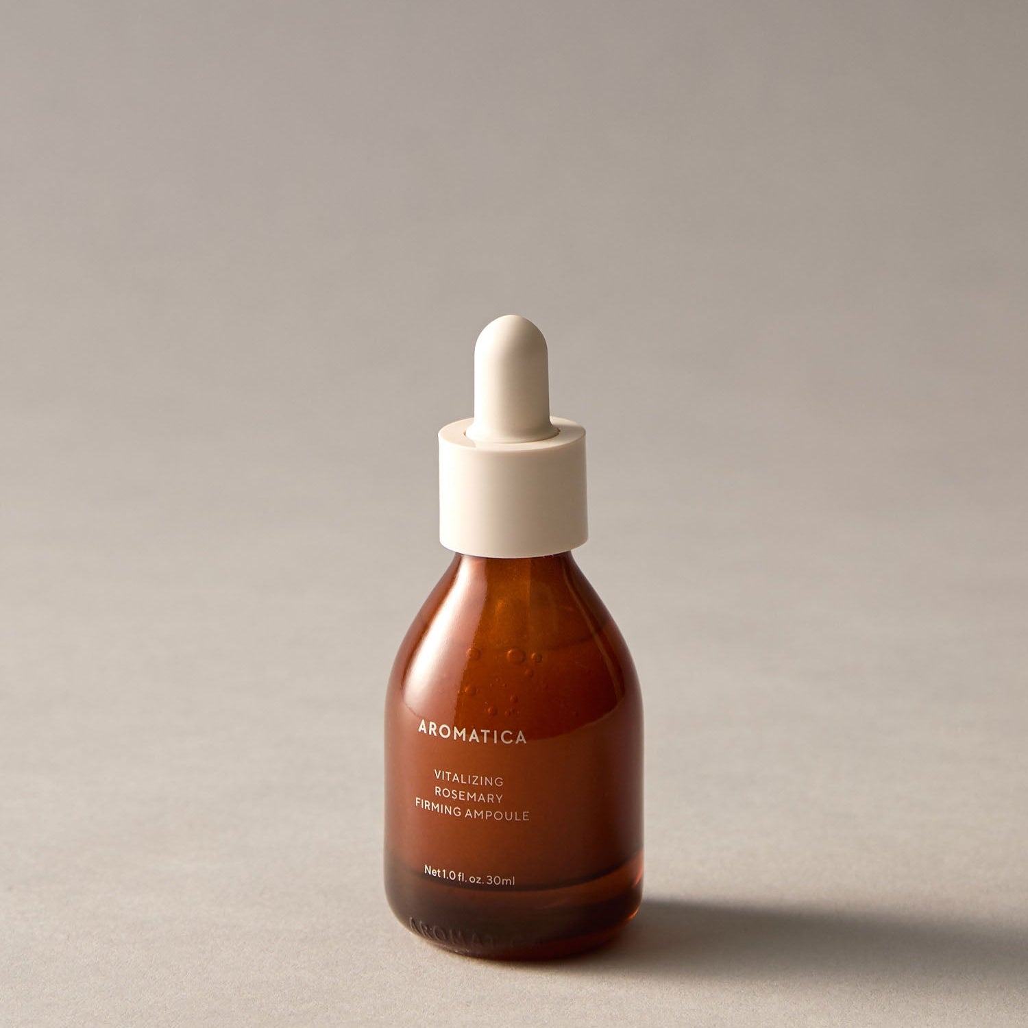AROMATICA Vitalizing Rosemary Elasticity Ampoule 30ML bottle on a grey background