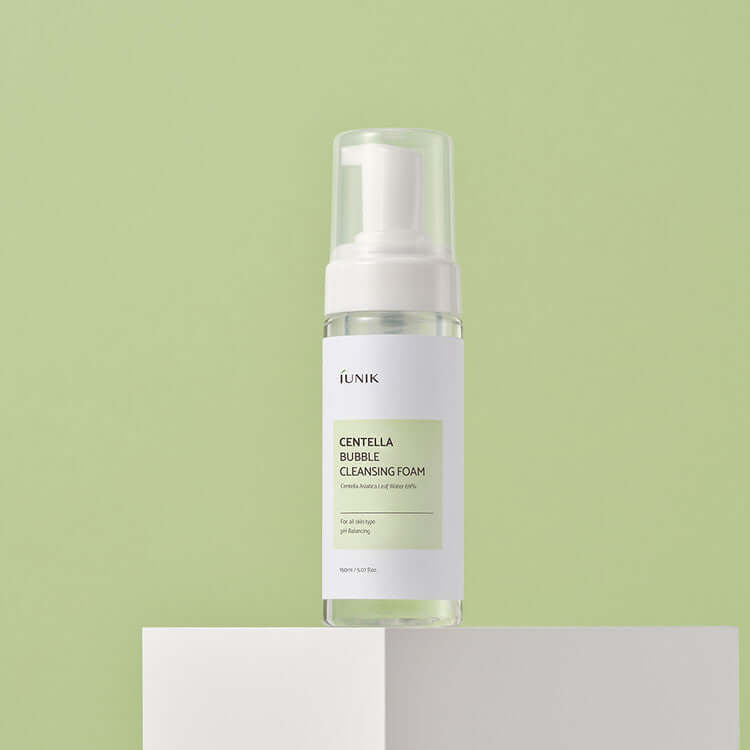 iUNIK Centella Bubble Cleansing Foam 150ml product on display with green background