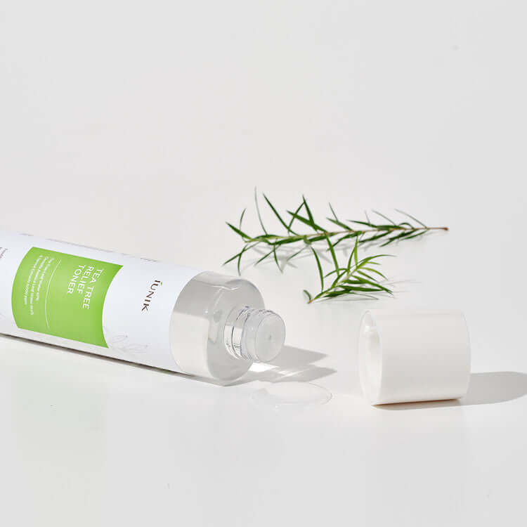 iUNIK Tea Tree Relief Toner 200ml product image with open cap and tea tree leaves in background