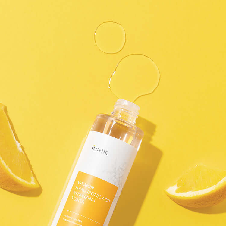 iUNIK Vitamin Hyaluronic Acid Vitalizing Toner 200ml with citrus slices on yellow background