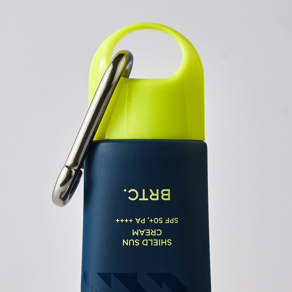 BRTC Homme Active Max Sheild Sunscreen 50ml bottle with carabiner cap for men by Gentleman Korea, navy and lime travel sunscreen for gentlemen