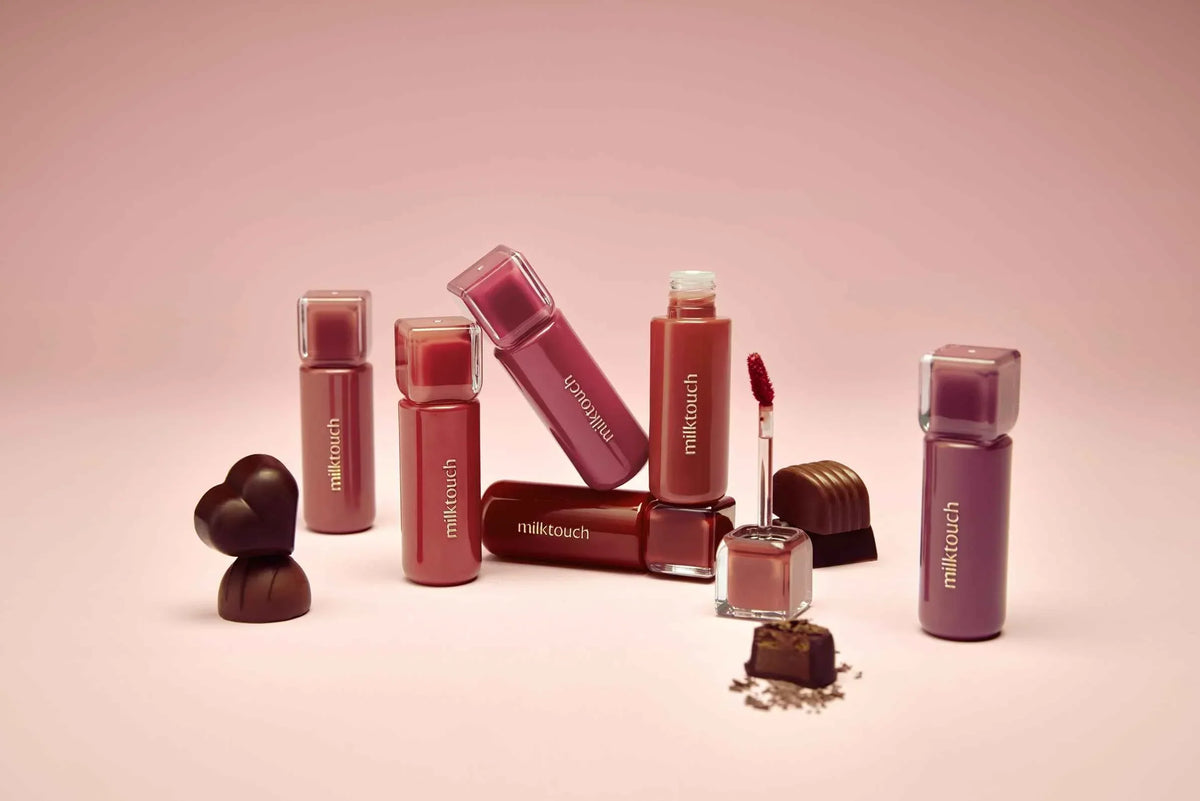 🌸 MILKTOUCH: The K-Beauty Secret for Soft, Radiant “Milk Skin” - collection of MILKTOUCH lip products on pink background.