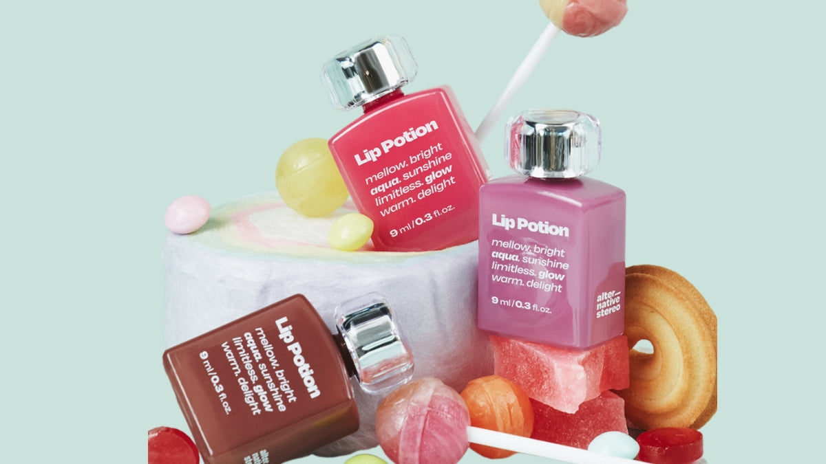 Elevating Skincare: Discovering the Innovation of Korean Brand Alternative Stereo - Lip Potion bottles with candy-themed background