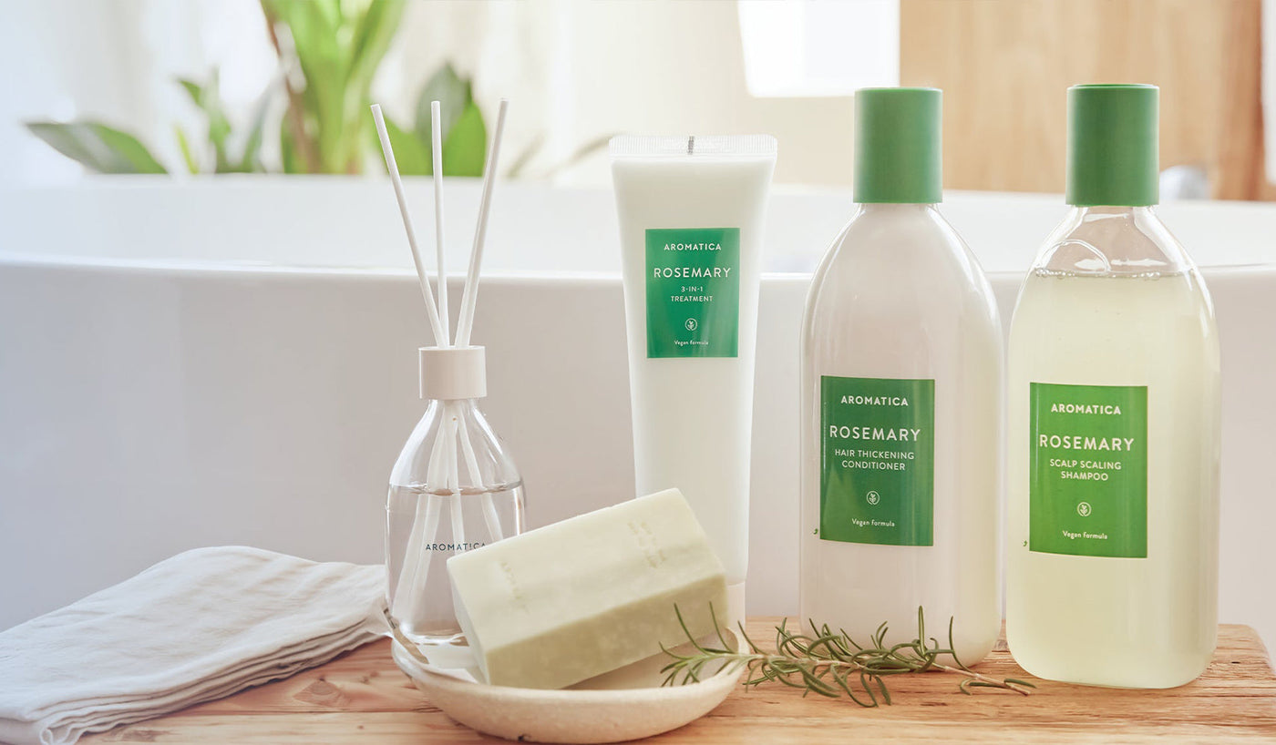Discovering AROMATICA: The Essence of Korean Beauty and Wellness - Aromatica rosemary shampoo, conditioner, and soap displayed in bathroom