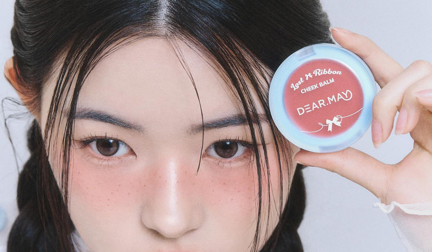 Discover DEAR MAY: Redefining K-Beauty Luxury with high-quality cheek balm showcased by model.