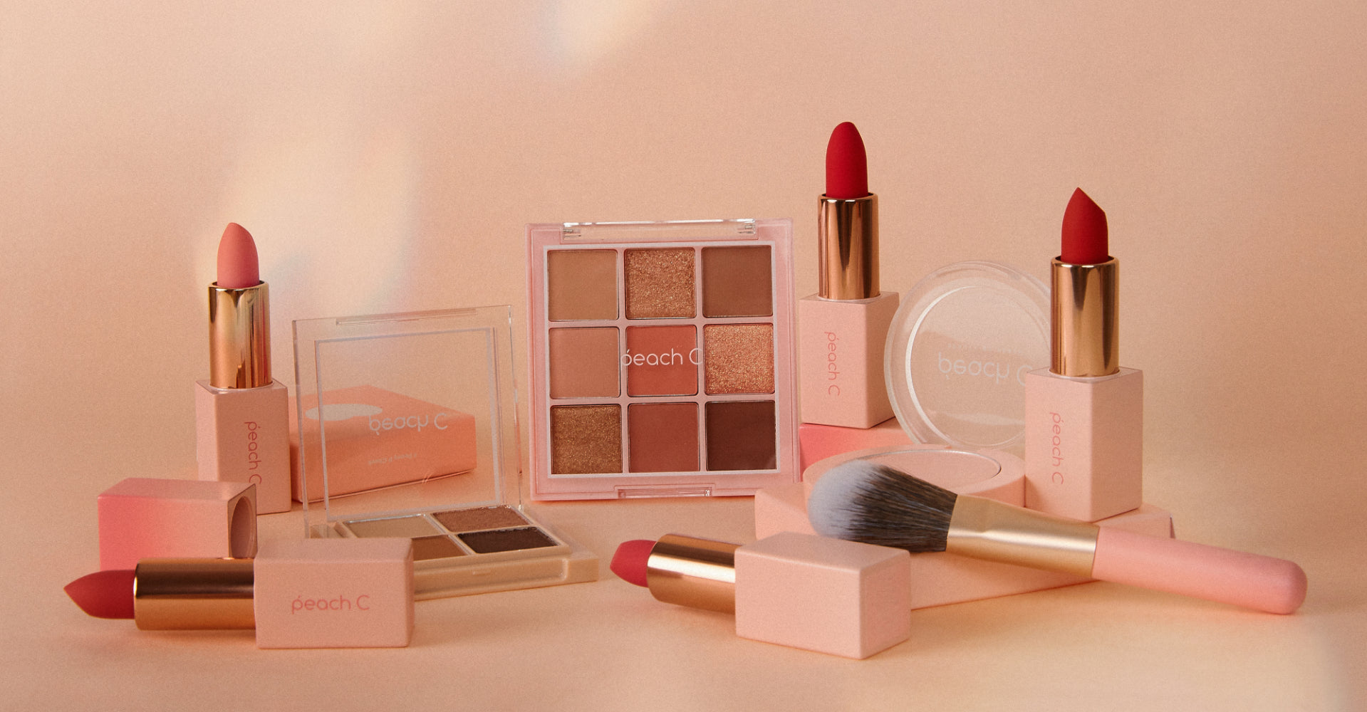 Sweet Skincare Delights: Exploring the World of Peach C products including lipsticks and eyeshadow palette on display.