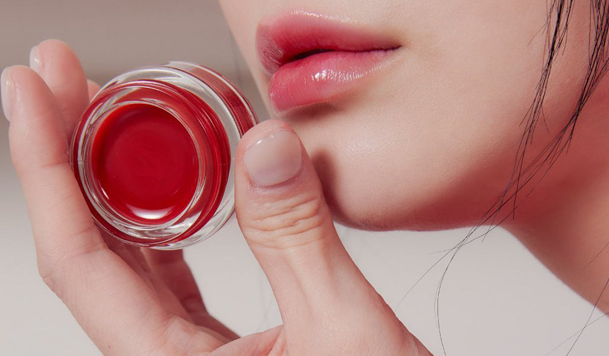 Experience Elegance with INGA: A New Standard in Korean Beauty - Close-up of red lip balm and lips