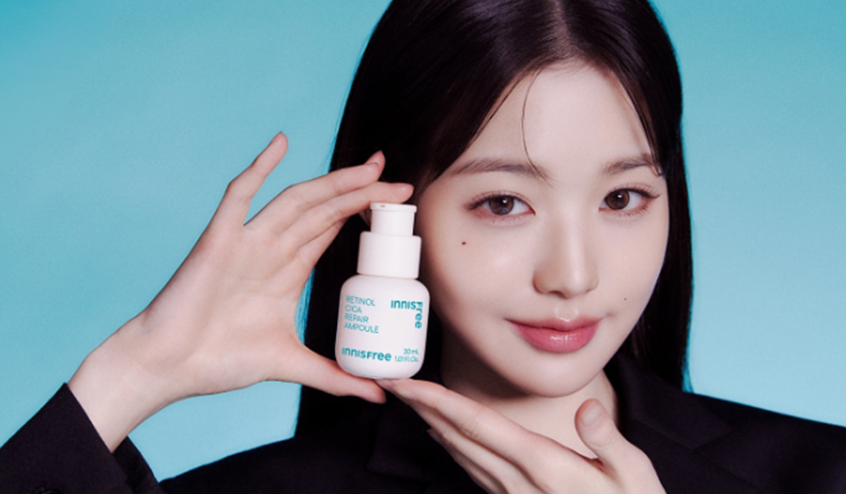 Discovering the Natural Charm of Innisfree: Woman holding Innisfree skincare product