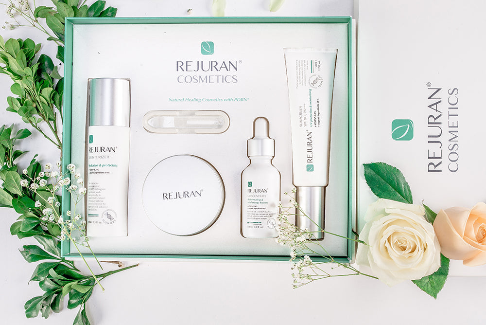 Unlock the Secret to Youthful Skin with REJURAN skincare set displayed beautifully with natural floral accents.