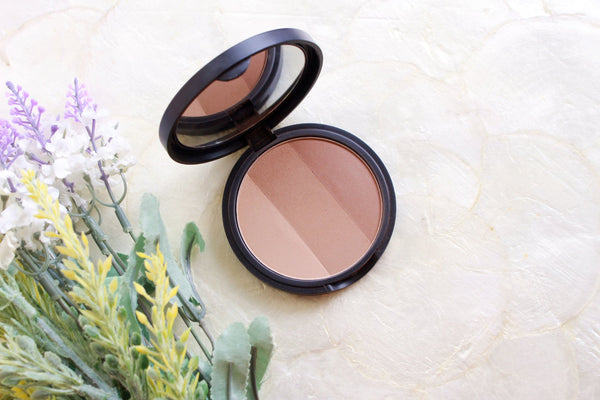 Too Cool for School: Redefining Korean Beauty with Playful Innovation compact set next to flowers