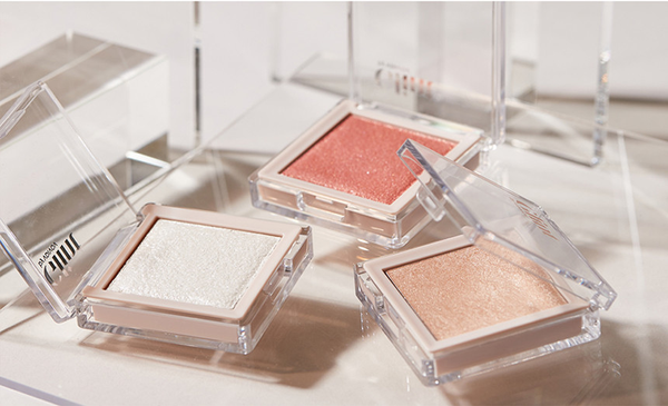 Unveiling GLINT: The Shimmering Elegance of Korean Cosmetics featuring vibrant eyeshadows in sleek packaging.