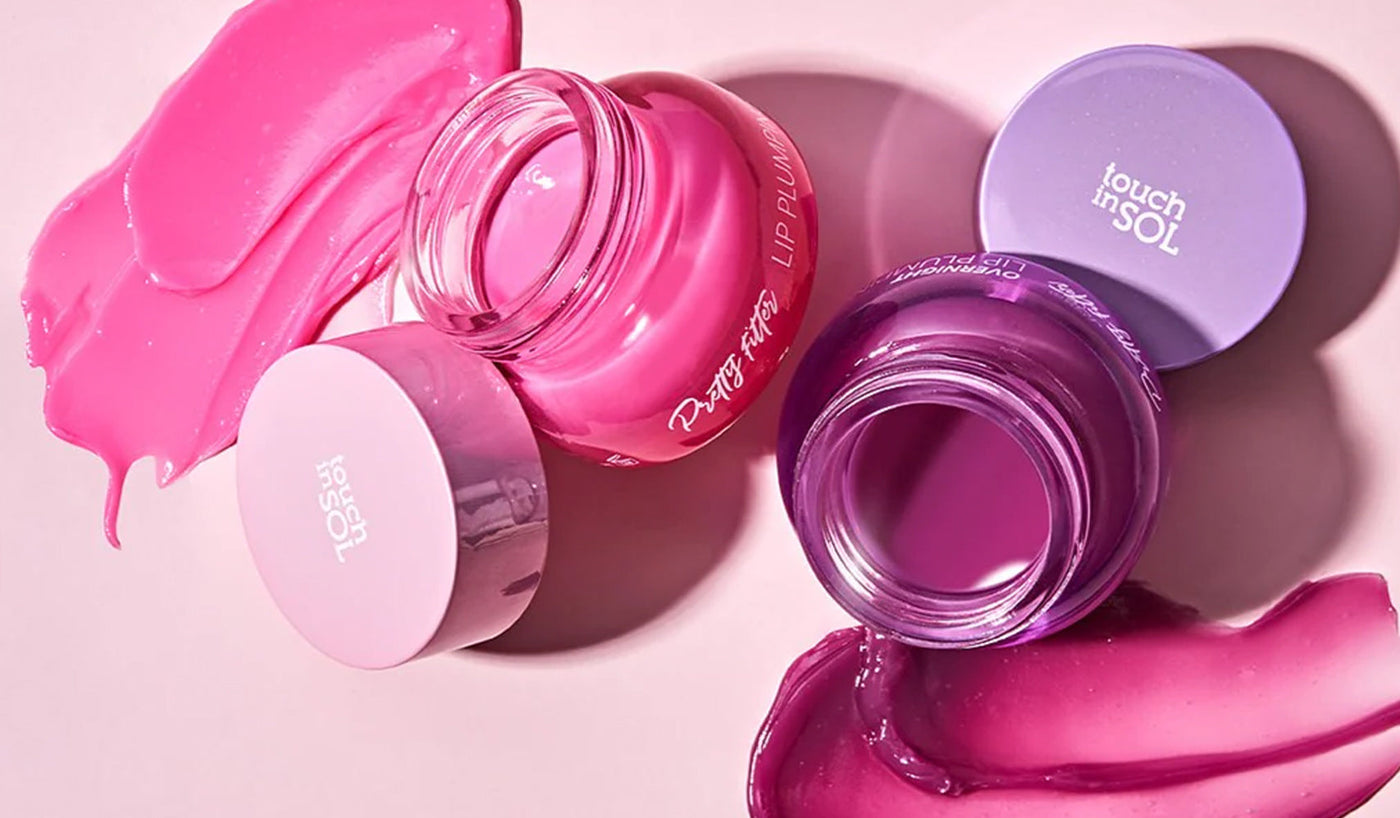 Explore the Excellence of TOUCH IN SOL: Korean Skincare and Makeup for Every Style with vibrant lip balms in pink and purple hues.