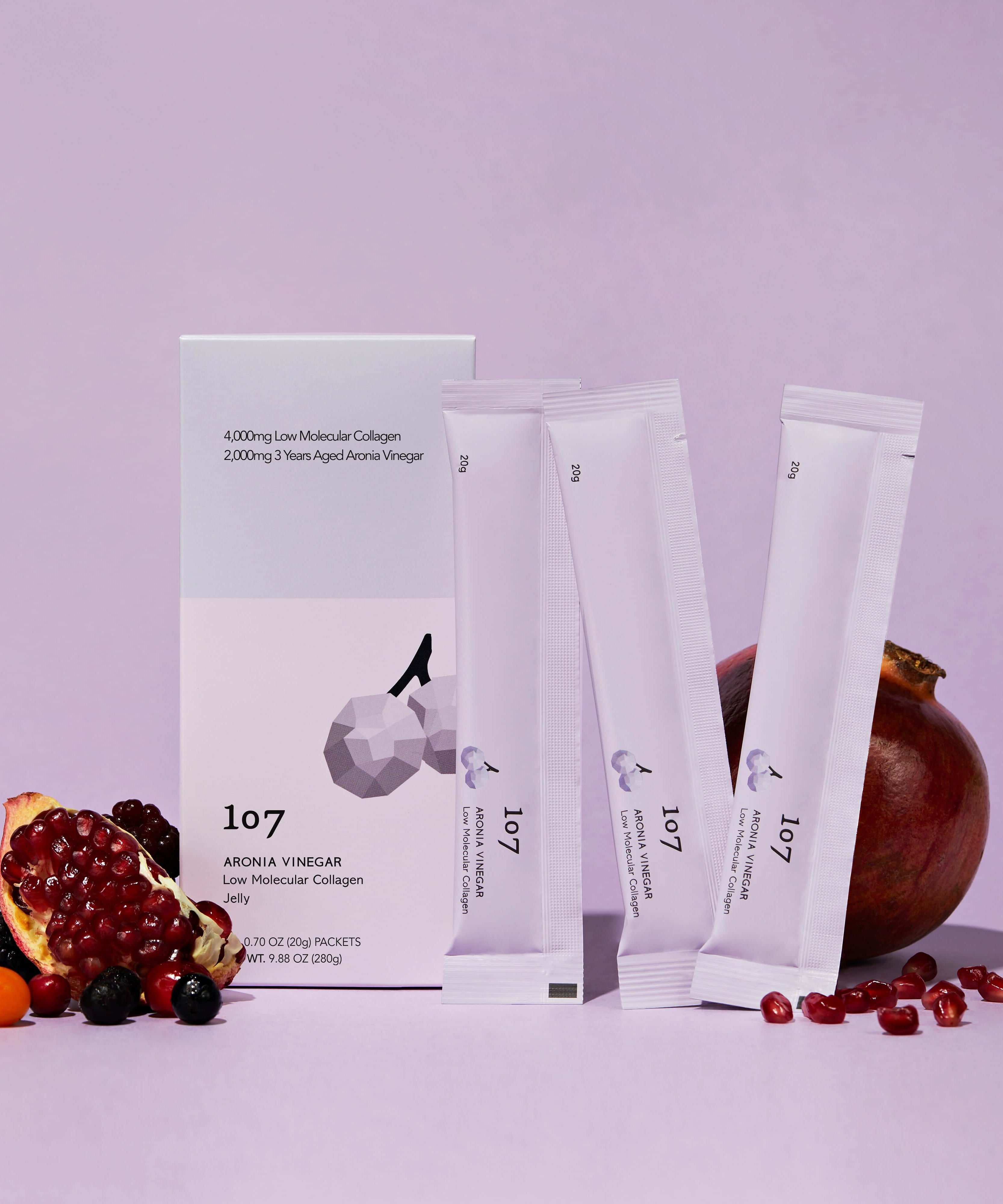 107 Aronia Vinegar Low Molecular Collagen 20g x 14 Packets with fruits displayed on a purple background