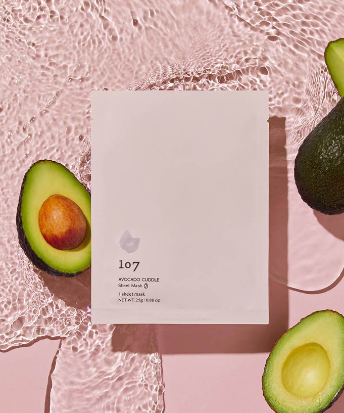 107 Avocado Curd Sheets Mask 5 Pieces displayed with avocados, featuring packaging design and natural skincare ingredients.