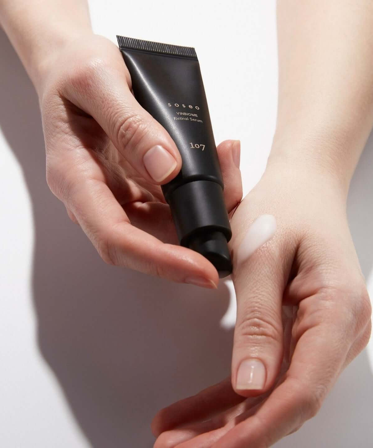 Applying 107 Soseo Vinbiome Retinal Serum 20ml on hand for skincare routine