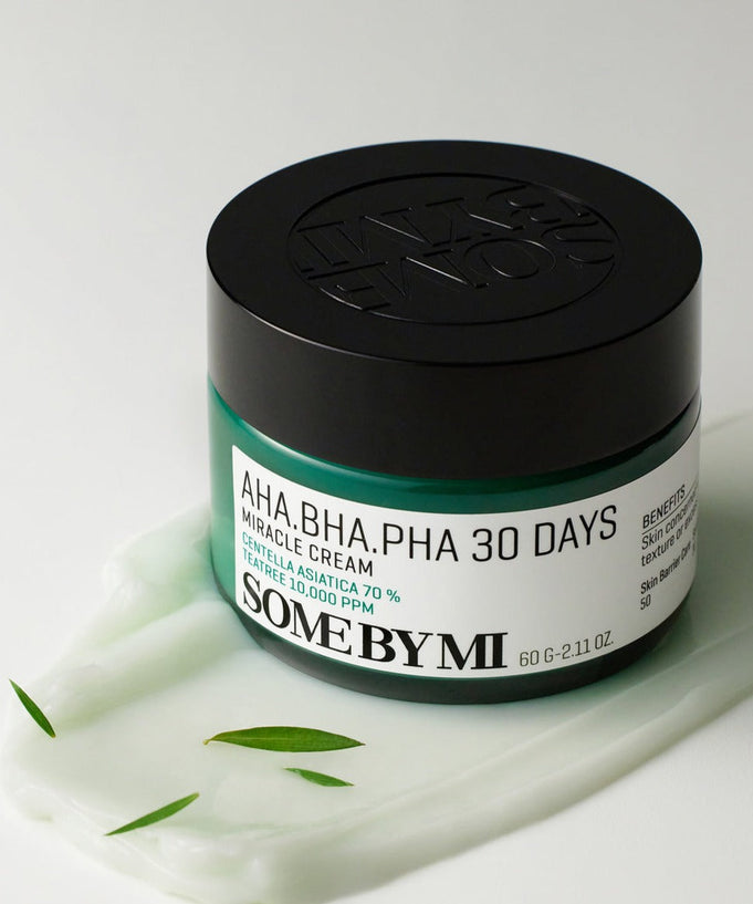 SOME BY MI AHA.BHA.PHA miracle cream 60g jar on a white background with green leaves
