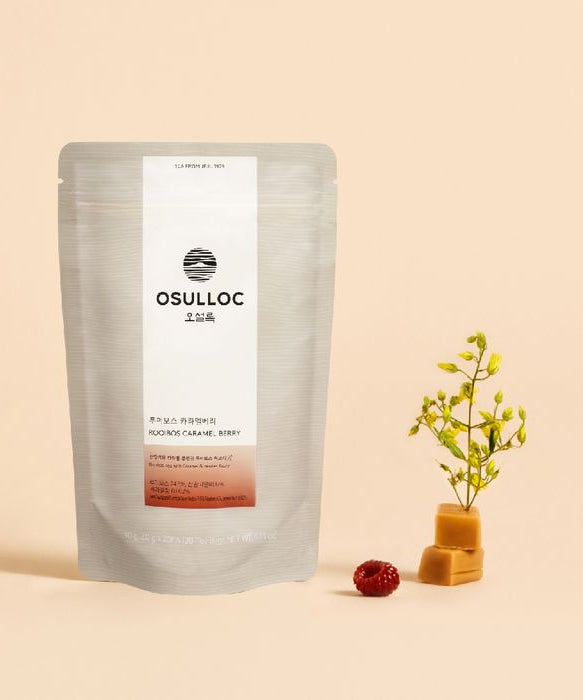 OSULLOC Rooibos Caramel Berry Tea 20p packaging with caramel pieces and berries on beige background