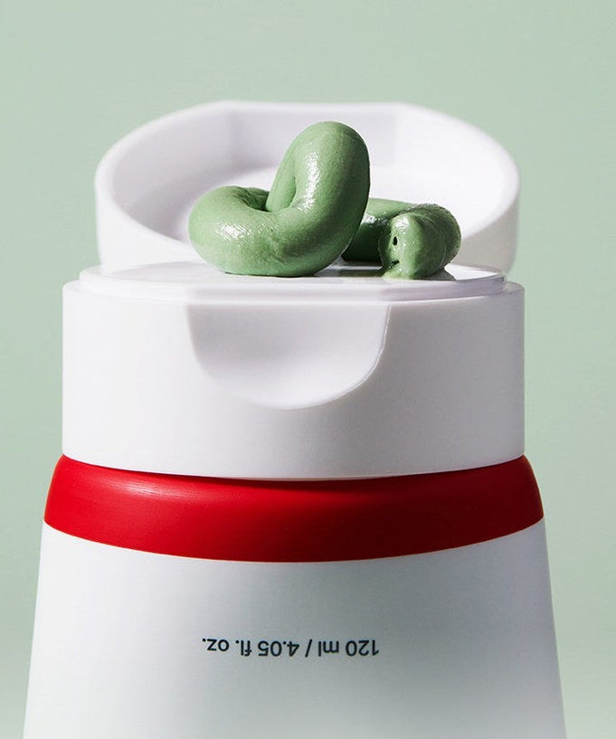 ACWELL Tea Tree Blemish Control Pack Cleanser 120ml with green cream on open cap against a light green background