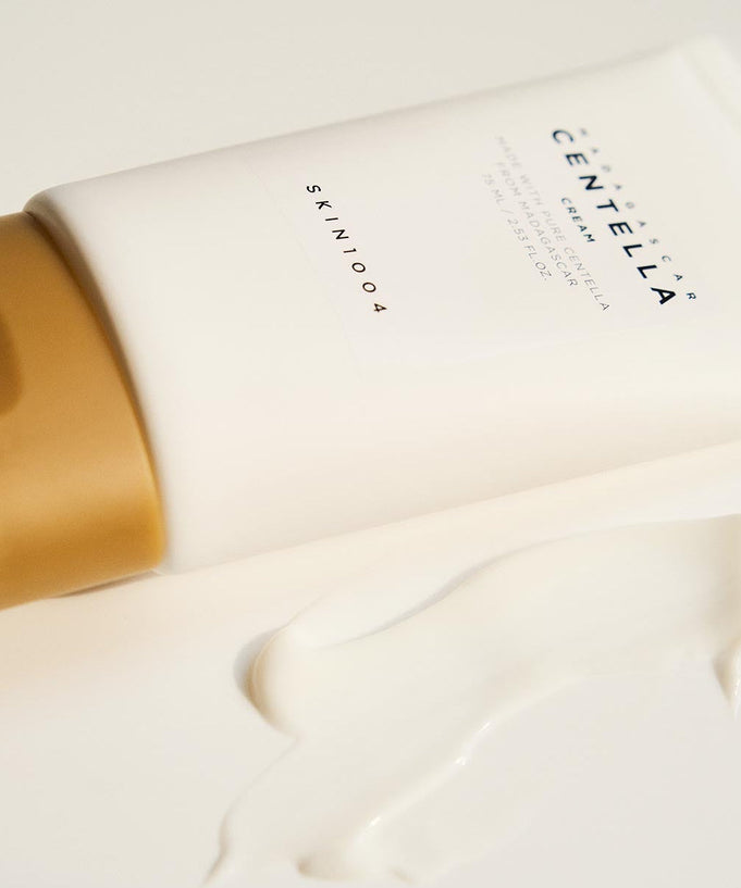 SKIN1004 Madagascar Centella Cream 75ml tube with cream swatch on white surface