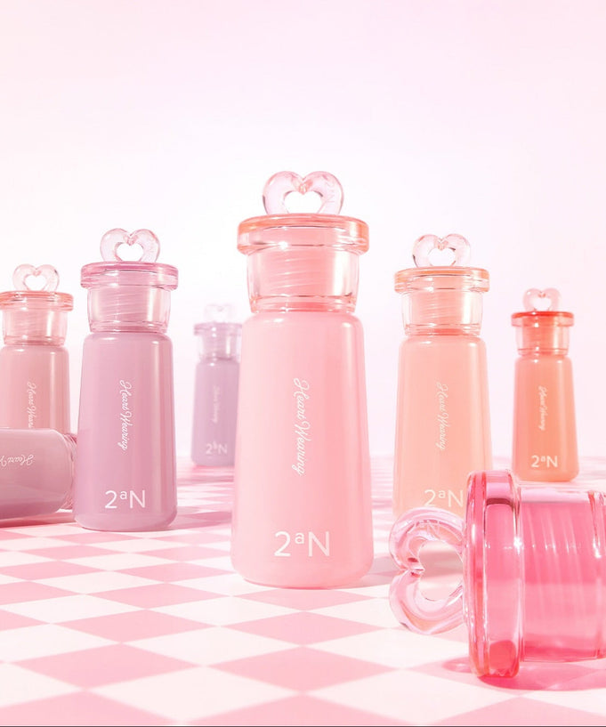 2AN Heart Wearing Liquid Cheek 4.4g bottles displayed in vibrant colors on a checkered surface