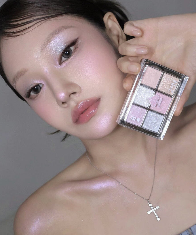 Model showcasing 2AN Better Me Eye Palette 4.5g with glittery eyeshadow shades.