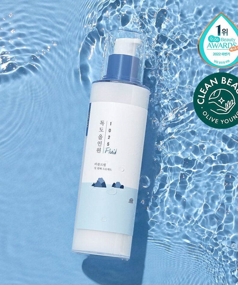 ROUND LAB 1025 Dokdo Fluid For Men 200ml - Gentleman Korea product image of blue and white pump bottle floating on water background