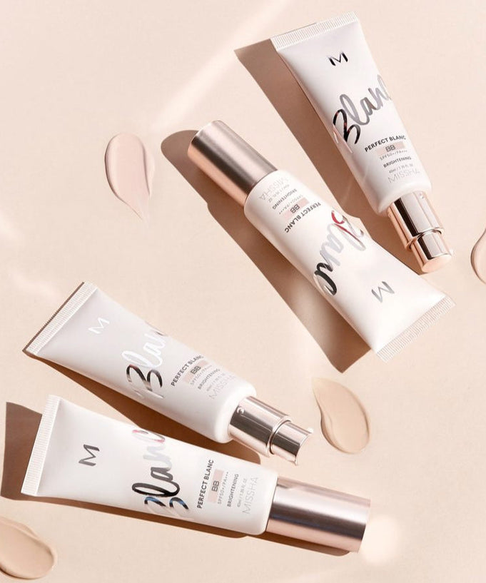 MISSHA M Perfect Blanc BB 40ml skincare tubes on a beige background with swatches.