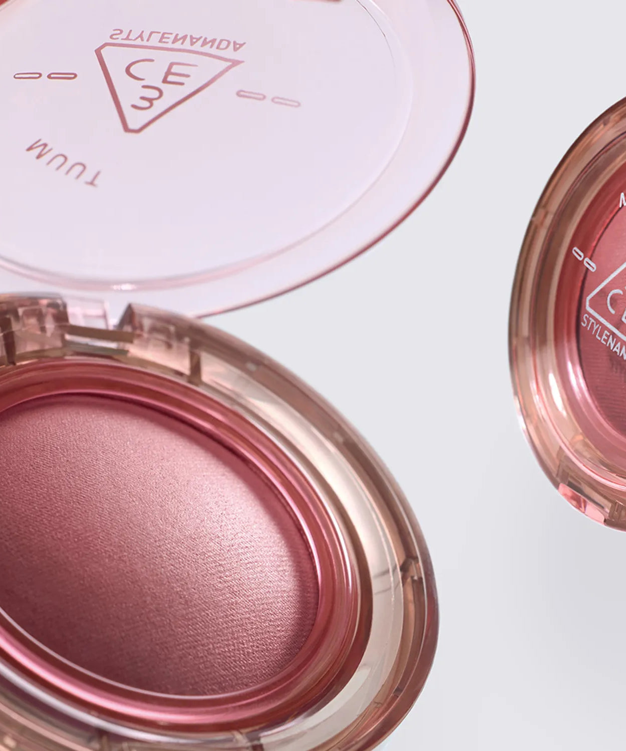 3CE Bouncy Blur Balm in pink, showcasing its smooth texture and compact design for easy application and travel.
