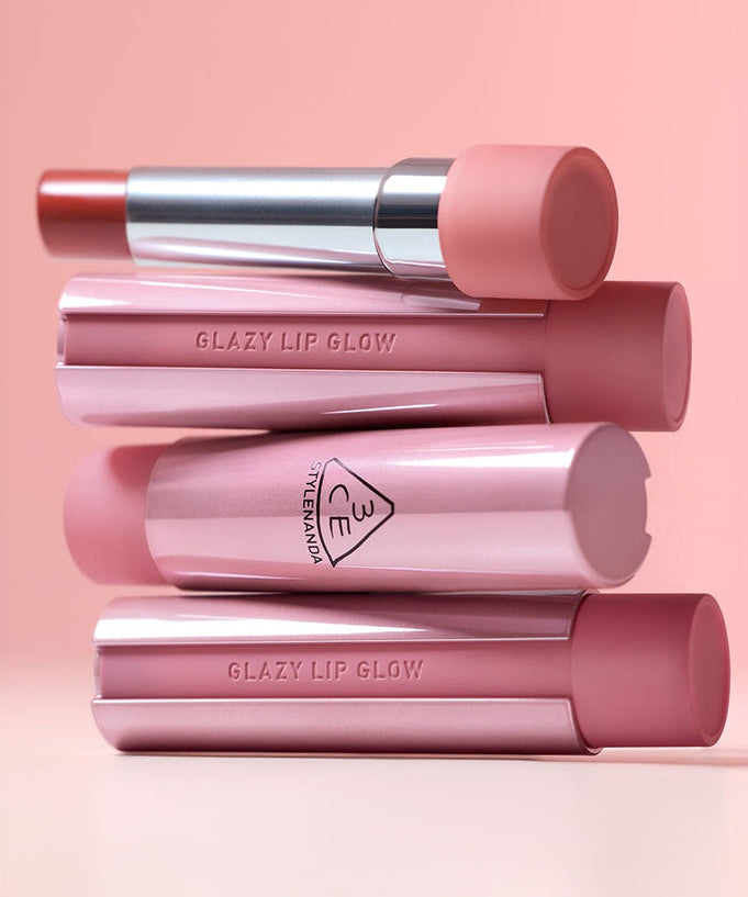 3CE Glaze Lip Glow 3.2g in various shades against a pink background, showcasing elegant design and vibrant colors.