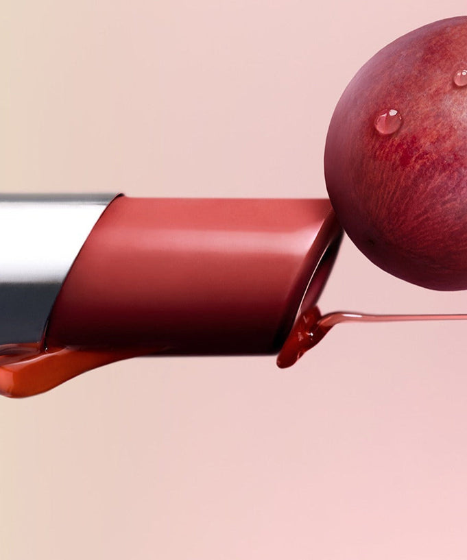 3CE Glaze Lip Glow 3.2g lipstick with glossy texture and grape accent, showcasing vibrant color and hydration features.