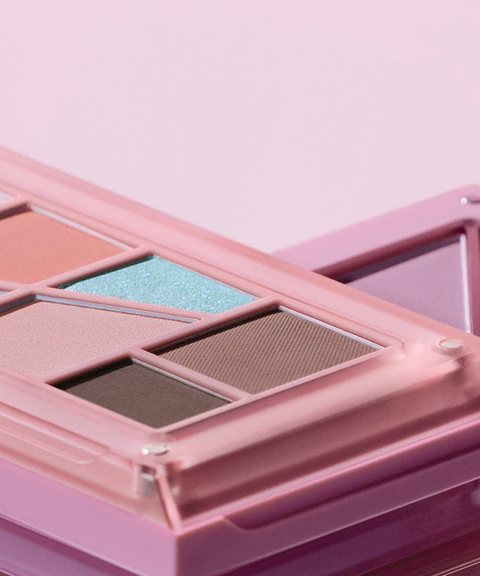 Close-up of 3CE Layer It All Eye Palette 7.5g featuring vibrant eyeshadow colors in a stylish pink case.