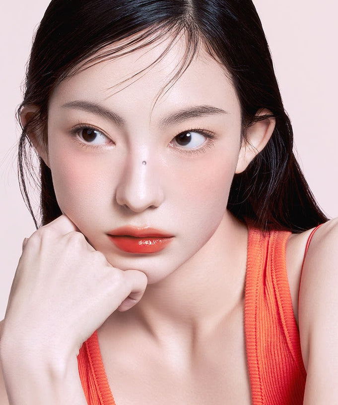 Model wearing 3CE Lazy Pop Lip Stain showing bold lip color and smooth finish