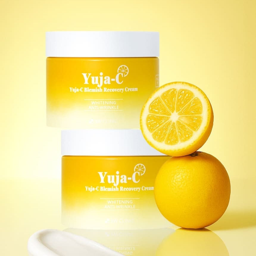 3W CLINIC Yuja Seed Blemish Recovery Cream 110g jars with fresh yuja fruit on a bright yellow background.