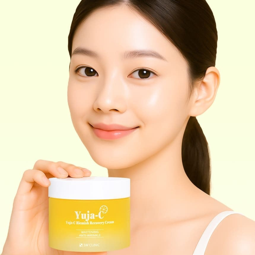 Woman holding 3W CLINIC Yuja Seed Blemish Recovery Cream 110g jar.