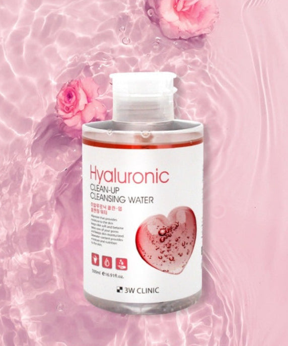 3W CLINIC Hyaluronic Clean Up Cleansing Water 500ml bottle on pink floral water background