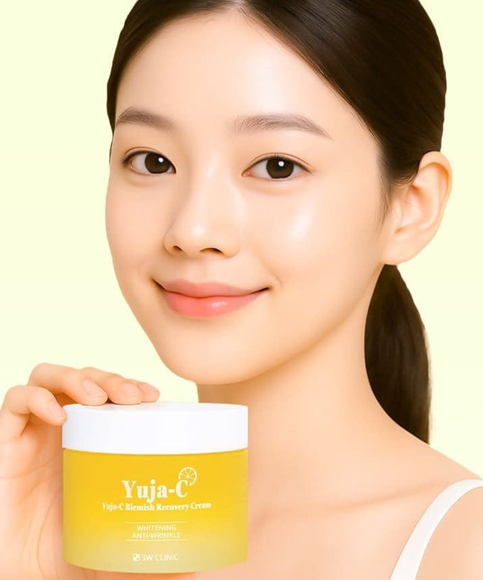 Woman holding 3W CLINIC Yuja Seed Blemish Recovery Cream 110g jar.