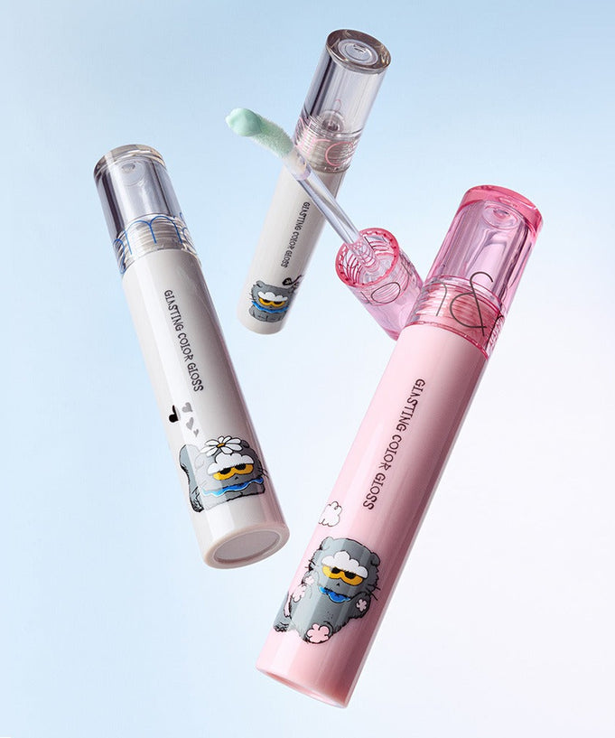 ROMAND x Joanne Friends Glasting Color Gloss tubes with playful character designs on light blue background