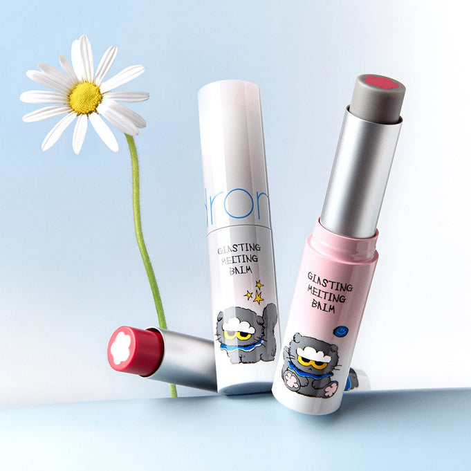 ROMAND x Joanne Friends Glasting Melting Balm displayed with colorful packaging and flower backdrop.