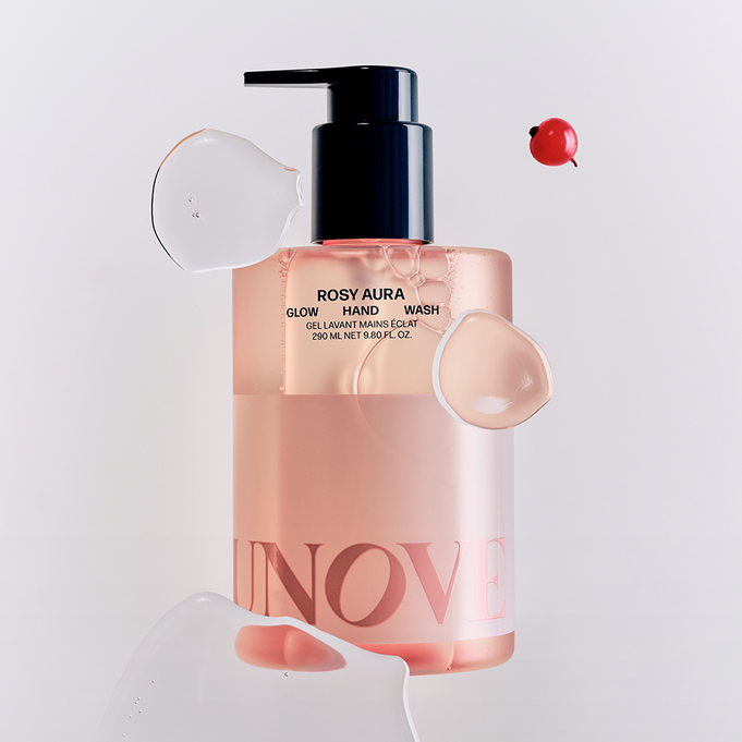 UNOVE Glow Hand Wash 290ml bottle with liquid splashes and decorative elements, highlighting its elegant packaging.