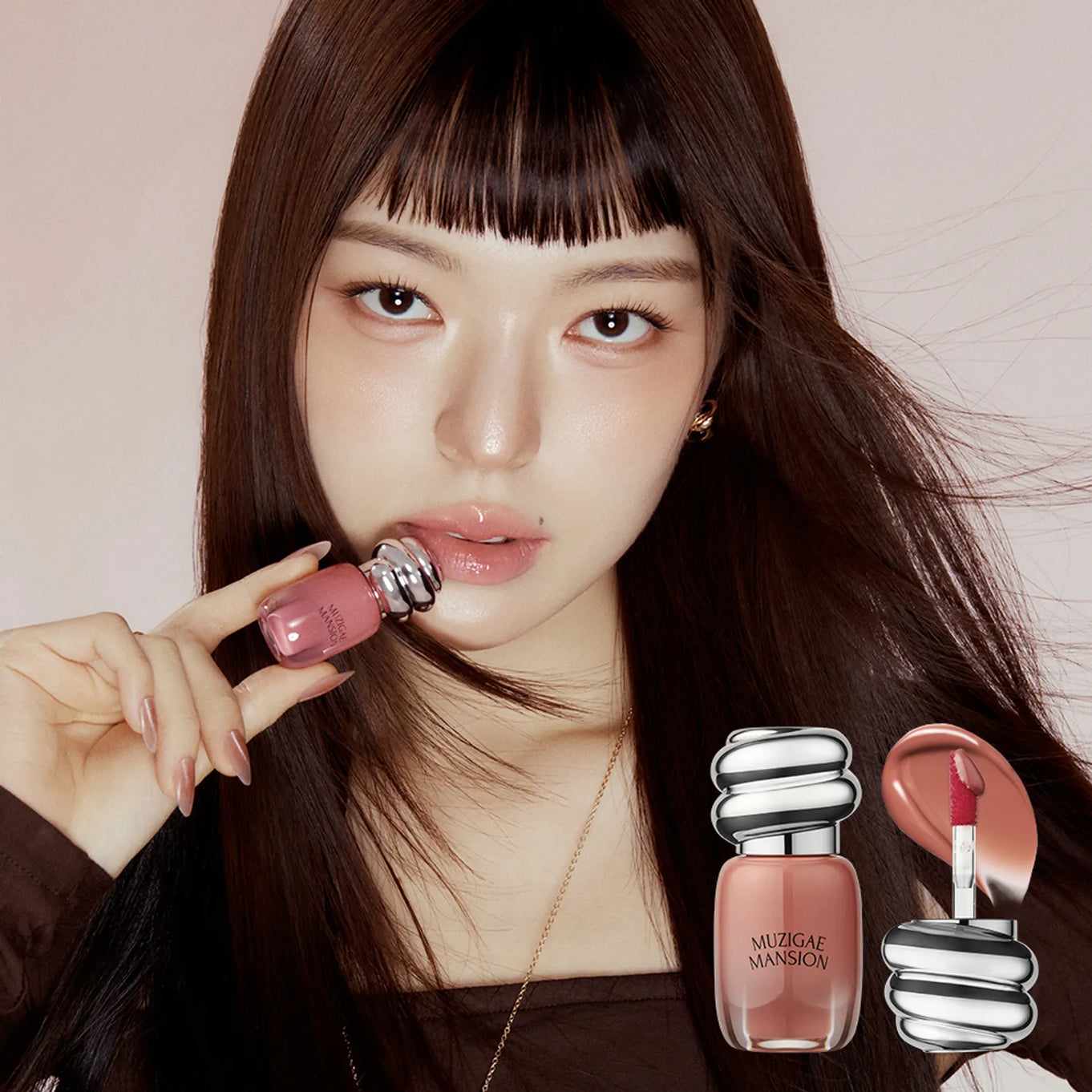 MUZIGAE MANSION Rainbow Mansion Object Glossy Mini 1.8g product held by model with lip gloss application