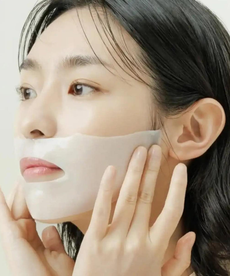 Woman applying ABIB Collagen Gel Mak Jericho Rose Jelly 10sheets to face